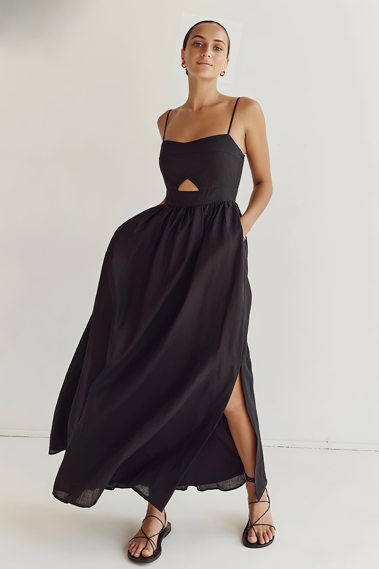 Side view of Kaia Dress showing flowy ankle-length silhouette in motion